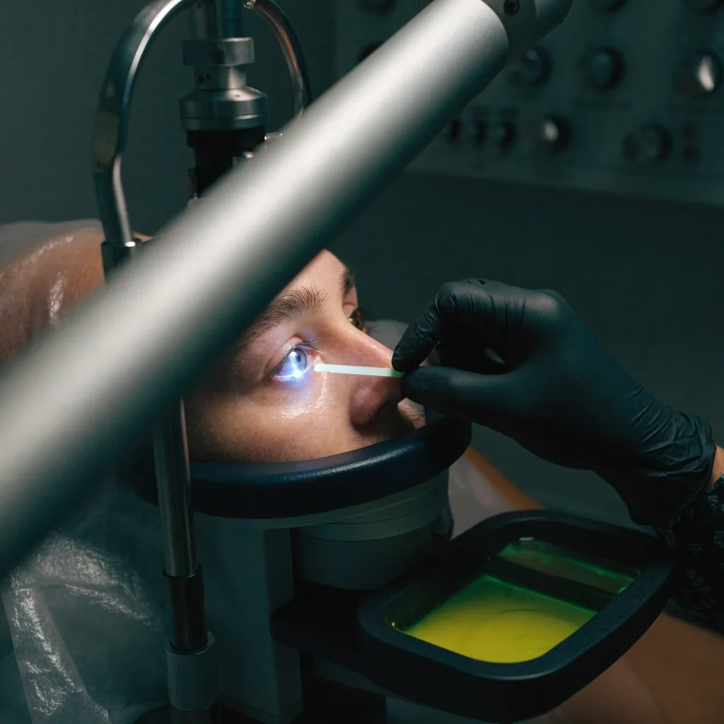 Ophthalmic instrument tray with blue surgical drape under low night light in a refractive measurement room